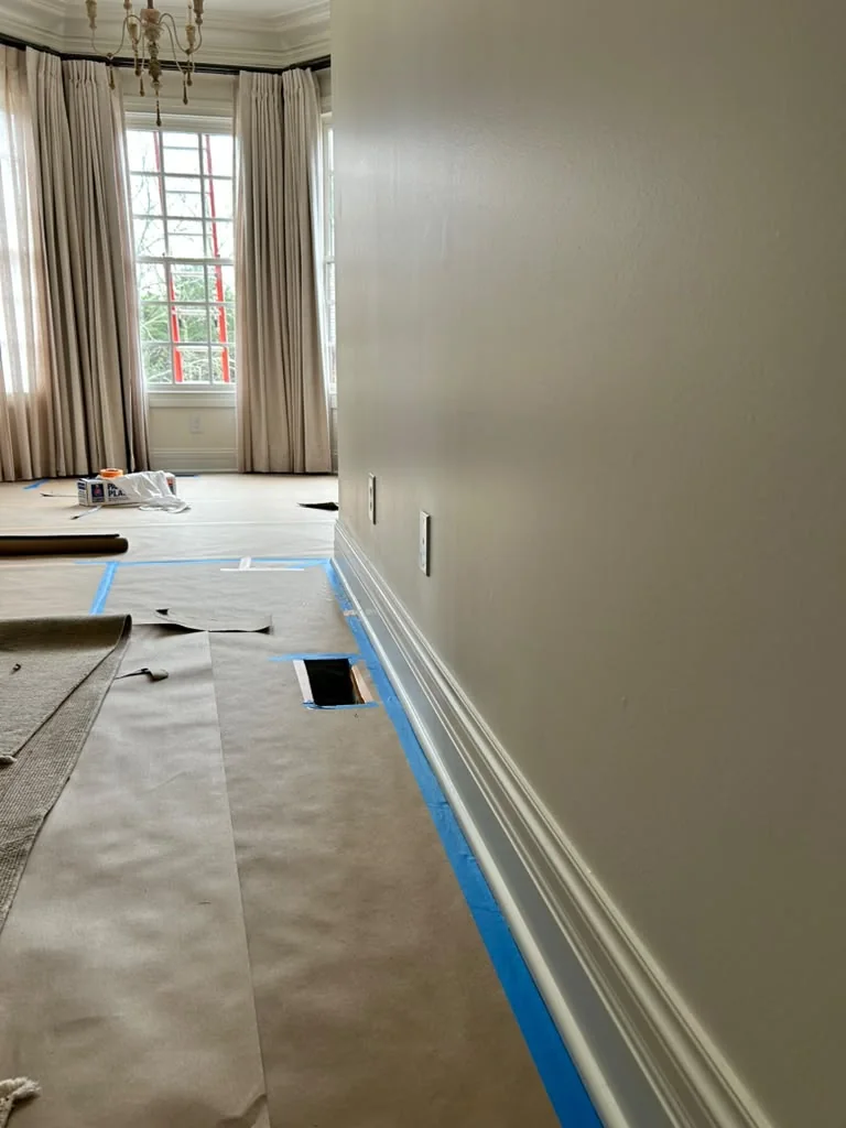 Interior floor and trim protected before painting