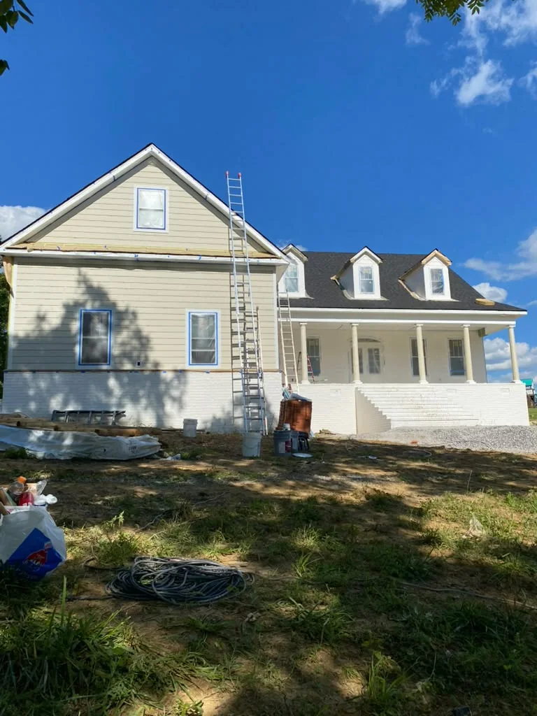 House exterior being prepared and painted